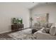 Vaulted living room with natural light, wood-look floors and inviting, modern features at 942 Shadow Hawk Rdg, Mesquite, NV 89027