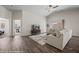 Vaulted living room with natural light, wood-look floors, and an open floor plan at 942 Shadow Hawk Rdg, Mesquite, NV 89027