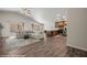 Open-concept living room and kitchen featuring lots of room, wood floors and vaulted ceiling at 942 Shadow Hawk Rdg, Mesquite, NV 89027