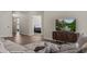 Living room with entertainment center and view into adjacent bedroom at 942 Shadow Hawk Rdg, Mesquite, NV 89027