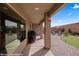 View of the backyard patio with outdoor seating and putting green at 942 Shadow Hawk Rdg, Mesquite, NV 89027