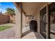 Outdoor patio with barbecue grill and a putting green in the landscaped backyard at 942 Shadow Hawk Rdg, Mesquite, NV 89027