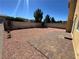 Backyard features a large brick paver patio and gravel landscaping at 10574 Salmon Leap St, Las Vegas, NV 89183