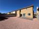 View of the rear of the home with sliding doors to the patio at 10574 Salmon Leap St, Las Vegas, NV 89183