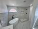 Luxurious bathroom featuring a modern soaking tub and a beautifully tiled shower at 10574 Salmon Leap St, Las Vegas, NV 89183