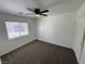 Bright bedroom features neutral walls, ceiling fan and plush carpeting at 10574 Salmon Leap St, Las Vegas, NV 89183