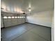 Spacious garage features concrete flooring and ample room for parking at 10574 Salmon Leap St, Las Vegas, NV 89183