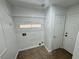 Bright laundry room featuring wire shelving, tile floors, and convenient washer/dryer hookups at 10574 Salmon Leap St, Las Vegas, NV 89183