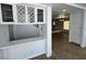 Open concept living room with tile floors, a cozy fireplace, and built-in cabinets and a wine rack at 10574 Salmon Leap St, Las Vegas, NV 89183