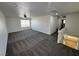 Spacious living room with neutral carpet, bright windows, and ceiling fan to keep you cool at 10574 Salmon Leap St, Las Vegas, NV 89183