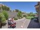 Landscaped backyard featuring stone pathways, desert plants, and scenic views for outdoor enjoyment at 10632 Clarion Ln, Las Vegas, NV 89134