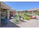 Lush backyard oasis featuring gravel landscaping, chaise lounge, and a tranquil outdoor living space at 10632 Clarion Ln, Las Vegas, NV 89134