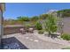 Spacious backyard with stone landscaping and outdoor seating, perfect for relaxing and enjoying the outdoors at 10632 Clarion Ln, Las Vegas, NV 89134