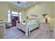 Well-lit bedroom boasts a bay window, a beautiful queen-sized bed, and ample storage space at 10632 Clarion Ln, Las Vegas, NV 89134