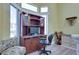 Comfortable bedroom features a desk and chair for work, and beautiful natural light at 10632 Clarion Ln, Las Vegas, NV 89134