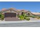 Attractive single-story home with desert landscaping and a terracotta roof with an attached two-car garage at 10632 Clarion Ln, Las Vegas, NV 89134