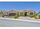 Charming single-story home featuring desert landscaping, a terracotta roof, and a two-car garage at 10632 Clarion Ln, Las Vegas, NV 89134