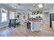 Modern kitchen and breakfast nook featuring stainless steel appliances and hardwood floors at 10632 Clarion Ln, Las Vegas, NV 89134