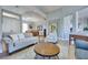 Open living room with hardwood floors, neutral colors, and modern furnishings at 10632 Clarion Ln, Las Vegas, NV 89134
