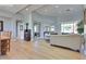 Bright, open-concept living room with wood floors, comfortable seating, and natural light at 10632 Clarion Ln, Las Vegas, NV 89134