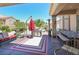 Enjoy outdoor living on this covered patio with dining and lounge area, and barbecue grill at 10632 Clarion Ln, Las Vegas, NV 89134
