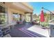 Inviting covered patio featuring ample seating arrangements and a convenient grill area for outdoor enjoyment at 10632 Clarion Ln, Las Vegas, NV 89134