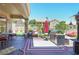 Inviting covered patio area with outdoor seating, a grill, and a cozy atmosphere for entertaining at 10632 Clarion Ln, Las Vegas, NV 89134