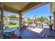 Covered patio boasts ample seating and a built-in grill, perfect for entertaining at 10632 Clarion Ln, Las Vegas, NV 89134