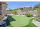 Backyard putting green providing a recreational space for outdoor activities and enjoyment at 10632 Clarion Ln, Las Vegas, NV 89134