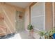 Cozy front door entryway with security door, plants, and decor at 1150 N Buffalo Dr # 1007, Las Vegas, NV 89128