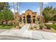 Beautiful building exterior with desert landscaping and well-maintained walkway at 1150 N Buffalo Dr # 1007, Las Vegas, NV 89128