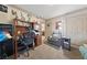 Functional home office with a comfortable chair and desk with overhead storage at 1150 N Buffalo Dr # 1007, Las Vegas, NV 89128