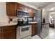 Kitchen featuring stainless steel appliances, dark cabinetry, and granite countertops at 1150 N Buffalo Dr # 1007, Las Vegas, NV 89128