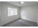 Bedroom featuring neutral walls, gray carpet and a window bringing natural light in at 134 Saint Albans Dr, Henderson, NV 89015