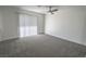 Bedroom featuring plush carpeting, a ceiling fan, and neutral paint throughout at 134 Saint Albans Dr, Henderson, NV 89015