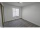 This bedroom features neutral walls, gray carpet and a window bringing natural light in at 134 Saint Albans Dr, Henderson, NV 89015