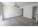 Large bedroom with a ceiling fan, plush carpet, and a sliding door closet with mirror at 134 Saint Albans Dr, Henderson, NV 89015