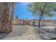 Charming single-story home featuring a tile roof, desert landscaping, and a stone walkway leading to the front door at 134 Saint Albans Dr, Henderson, NV 89015