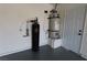 Water heater and water filtration system installed in the well-maintained garage at 134 Saint Albans Dr, Henderson, NV 89015