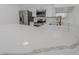 Detailed view of the kitchen's elegant quartz countertop, stainless steel appliances, and pristine cabinetry at 134 Saint Albans Dr, Henderson, NV 89015