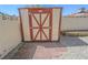 A backyard storage shed offering convenient outdoor storage, with pavers in front at 134 Saint Albans Dr, Henderson, NV 89015