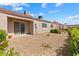 Private gravel backyard with mature landscaping and great natural light at 1411 Di Blasi Dr # 104, Las Vegas, NV 89119