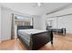 Bedroom featuring a closet with sliding mirror doors and wood flooring at 1411 Di Blasi Dr # 104, Las Vegas, NV 89119