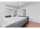 Clean bedroom with wood floors and an en suite bathroom at 1411 Di Blasi Dr # 104, Las Vegas, NV 89119