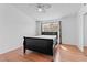 Cozy bedroom with wood floors and a view of the outdoors at 1411 Di Blasi Dr # 104, Las Vegas, NV 89119