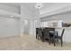 Dining area featuring tile floors and an open layout with a pass-through to the kitchen at 1411 Di Blasi Dr # 104, Las Vegas, NV 89119