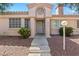 Inviting single-story home featuring a decorative facade and well-maintained desert landscaping for great curb appeal at 1411 Di Blasi Dr # 104, Las Vegas, NV 89119
