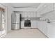 Well-lit kitchen with modern appliances, tile flooring, and direct access to the outdoor area at 1411 Di Blasi Dr # 104, Las Vegas, NV 89119
