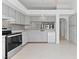 Bright kitchen showcasing updated appliances, ample counter space and tile flooring at 1411 Di Blasi Dr # 104, Las Vegas, NV 89119