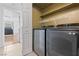 Convenient laundry room equipped with a modern washer and dryer set, offering efficient laundry solutions at 1411 Di Blasi Dr # 104, Las Vegas, NV 89119